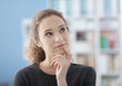 © StockPhotoPro - Girl thinking with hand on chin