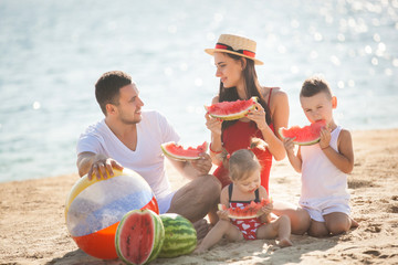 Wall Mural - Cheerful family on the beach. Family on vacation