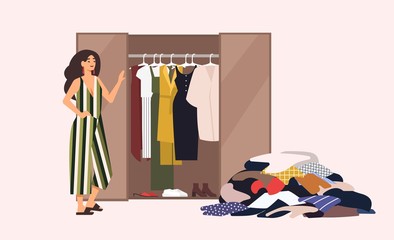 Smiling long-haired girl standing in front of opened closet with apparel hanging inside and pile of clothes on floor. Concept of minimalist capsule wardrobe. Cartoon vector illustration in flat style.