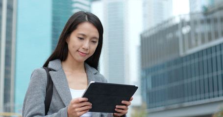 Sticker - Woman use of tablet computer in city