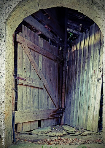 Fotografia, Obraz door of a stable to access two different rooms using a single en