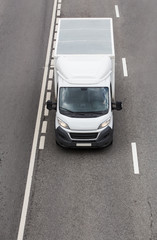 Poster - Truck is moving on a multi-lane highway.