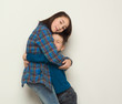 © Prostock-studio - Happy brother and sister hug, studio background
