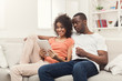 © Prostock-studio - Black couple making using digital tablet at home