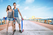 © Svetlana Radayeva - Young man and woman with skateboard