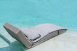 © Vatcharachai - Relaxing or Leisure rattan chair bed in swimming pool .