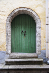 Wall Mural - Old wooden door in old town