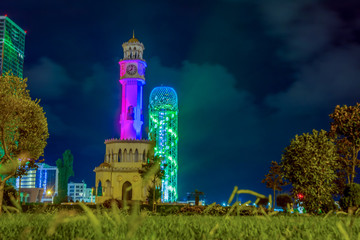 Canvas Print - Alphabet and clock tower at night, Batumi