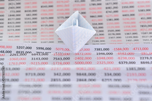 Origami Paper White Boat Floating On A Folded Sheet Of Paper