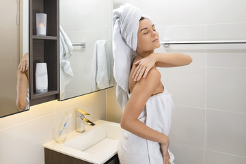 Wall Mural - Beautiful woman wrapped in the towel after shower