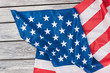 Flag of America on wooden background, top view. USA patriotic flag on a weathered wood background with copy space for message.