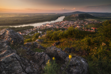Wall Mural - View of Small City of Hainburg an der Donau with Danube River as Seen from Rocky Hundsheimer Hill at Beautiful Sunset