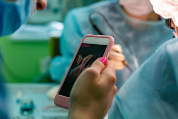 Poster - Surgeons operating a patient in operating room