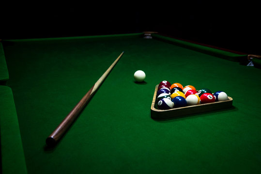 Fototapete - Billiards balls on the green table