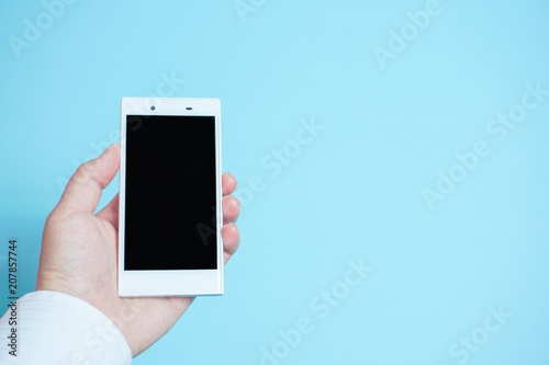 Fotografie, Obraz Using mobile phones in business scene.. スマートフォンを使う 水色背景