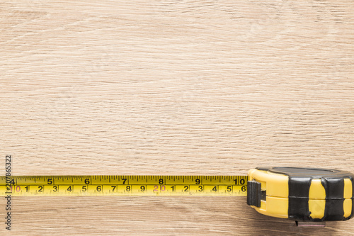 Download Old Yellow Measuring Tape On Light Brown Wooden Plank Mock Up For Special Offers As Advertising Or Other Ideas Frame Border On Desk Empty Place For Text Or Logo Top View Stock