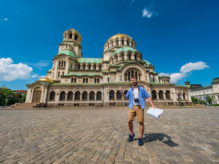 Young caucasian man in Alexander Nevsky cathedral in Sofia, Bulgaria. Solo traveler concept.