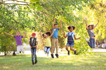 Sticker - Cute little children playing together outdoors on sunny day