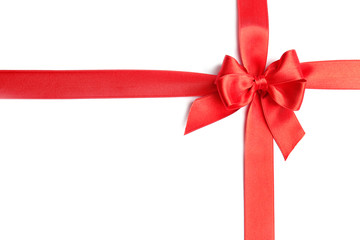 red ribbons with bow on white background, top view