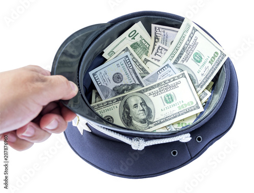 Fotomural A policeman's hand holds a cap with money- symbolic image of a bribe or corruption