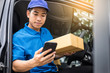 © snowing12 - messenger man hold box and talk on smart phone and payment terminal in hands, Package delivery concept.