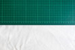 Half of green cutting mats and white background