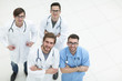 © ASDF - view from the top. team of doctors looking at the camer
