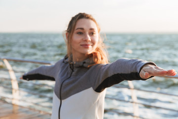 Sticker - Smiling young girl standing in yoga pose