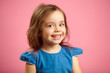 © Ilshat - beautiful surprised child girl with cute smile and sincere look, is in a good mood, expresses joy and happiness, close up kid portrait on pink background.