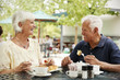 © Monkey Business - Portrait Of Senior Couple Enjoying Meal At Outdoor Cafe