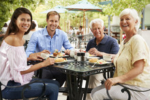 Senior Couple Enjoying Meal At Outdoor Cafe