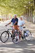 © Monkey Business - Smiling Senior Couple Cycling On Country Road