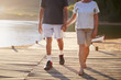 © Monkey Business - Close Up Of Romantic Senior Couple Walking On Jetty By Lake