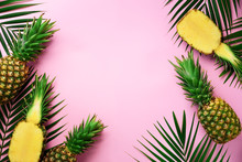 Half Slice Of Fresh Pineapple And Whole Fruit, Palm Leaves On Yellow Background. Top View. Copy Space. Bright Pineapples Pattern For Minimal Style. Pop Art Design, Creative Concept