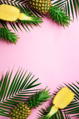 Wall Mural - pattern with bright pineapples on yellow background. top view. copy space. minimal style. pop art de