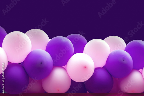 Bundle of balloons pink and purple background