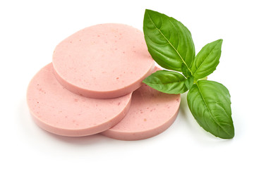 Salami sausage slices with basil, isolated on white background.