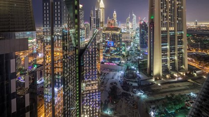 Wall Mural - Skyline view of the buildings of Sheikh Zayed Road and DIFC night timelapse in Dubai, UAE.