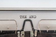 The End Is Written On Paper With Typewriter.
