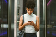 © Lauren Naefe/Stocksy - Young professional on cell phone in the city