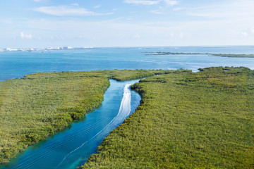 Sticker - A canal in the middle of the mangrove surrounding the Cancun bay Nichupté