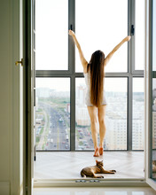Woman Stretching On Balcony