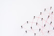 Linking entities, social media, Communications Network, The connection between the two networks. Network simulation on white paper linked together with a red thread with copy space