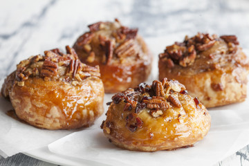 Sweet Pecan Rolls on White Plate