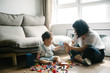 © MaaHoo Studio/Stocksy - Baby boy playing with toy at home