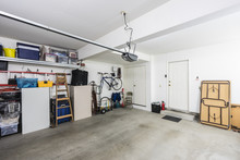 Clean Organized Suburban Residential Two Car Garage With Tools, File Cabinets And Sports Equipment.  