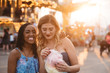 © Chelsea Victoria/Stocksy - Two young female friends having fun at a carnival