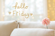 Hello Friday message with a flower in a bright interior room sofa