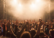 © RGBImages/Stocksy - Rock band performer cheering up the crowd at music festival