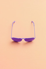 Wall Mural - Flat lay fashion set: sunglasses on pastel backgrounds. Fashion summer is coming concept.